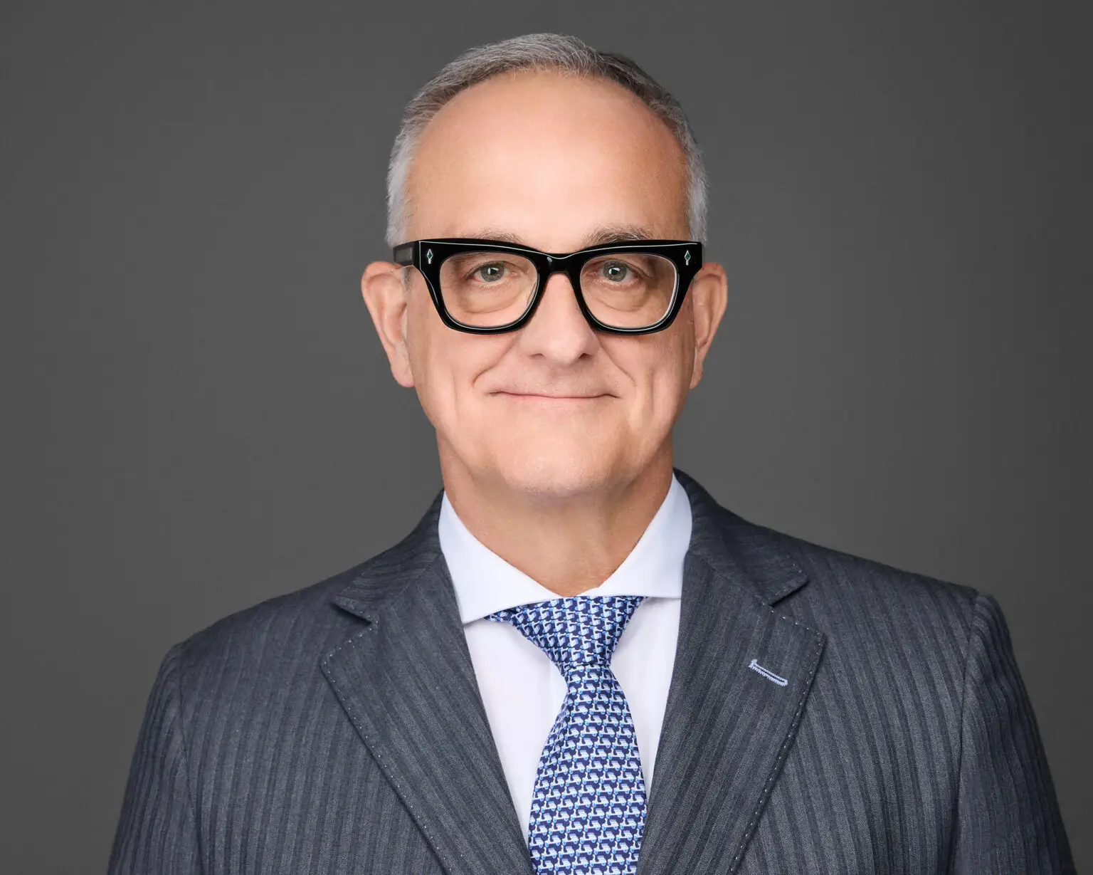 studio headshot on gray background in Orange County